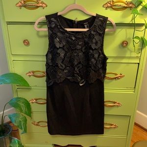 Black mini dress with leather flower detail